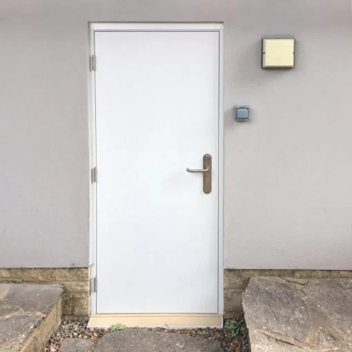 Budget-steel-door-white-in-grey-wall-510x510
